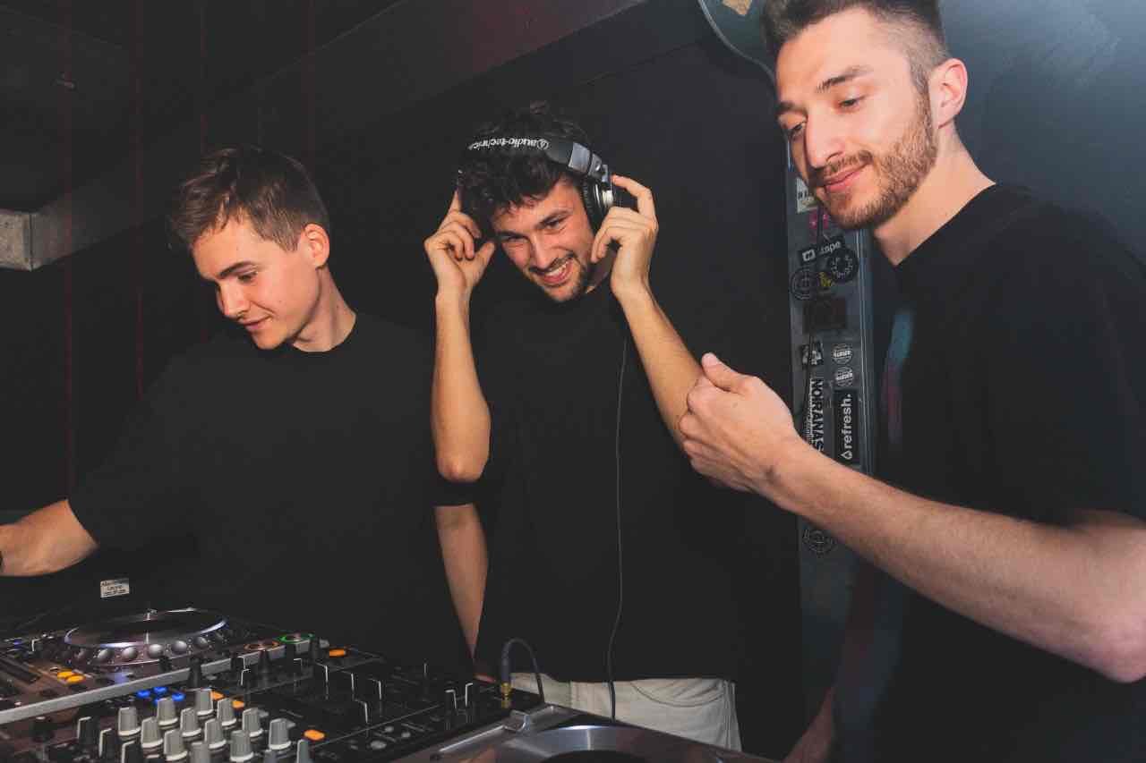 DJ trio performing at the mixer