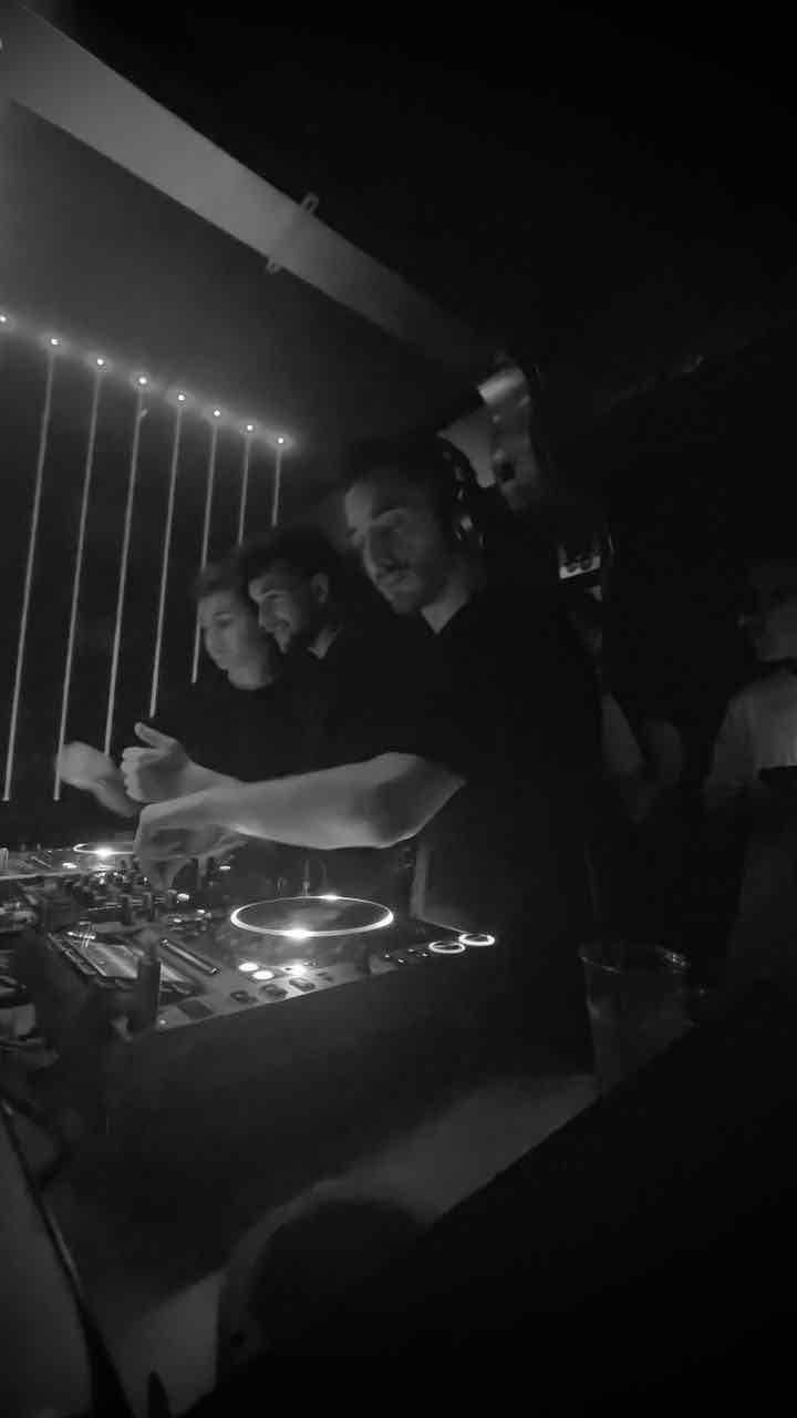 Black and white shot of DJ group
