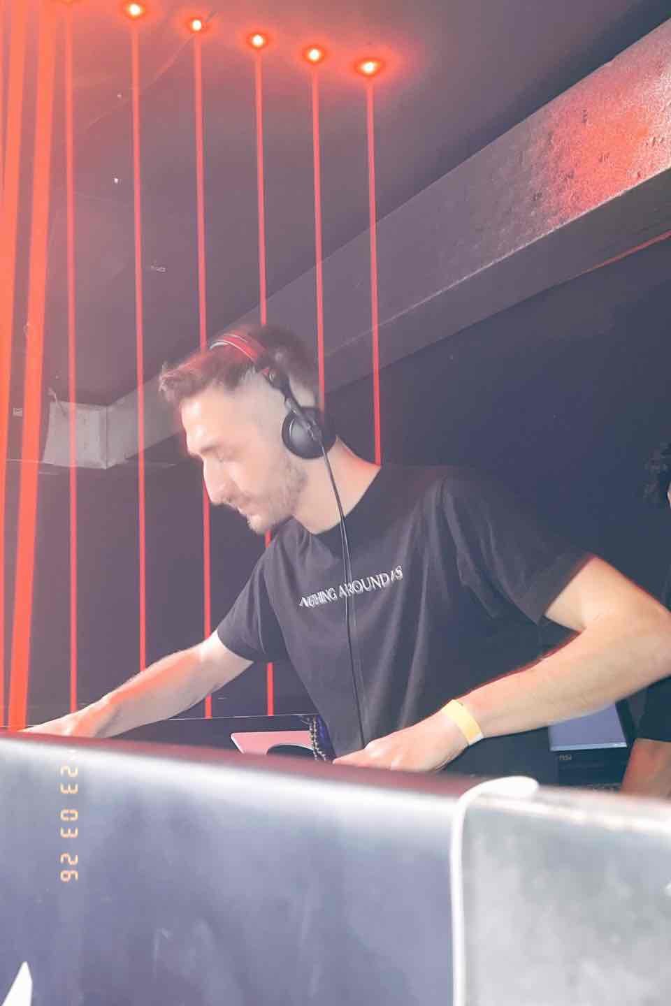 DJ under red laser lights